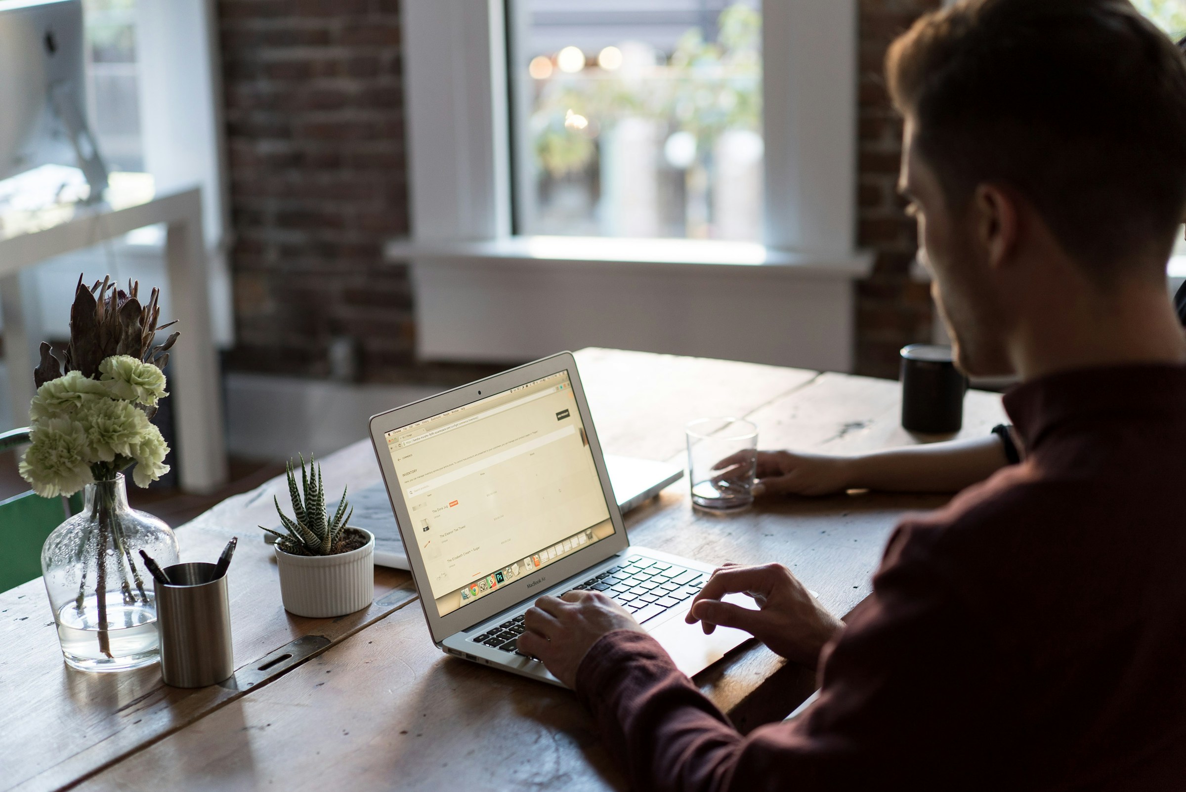 Person Using Laptop - AI Content Repurposing