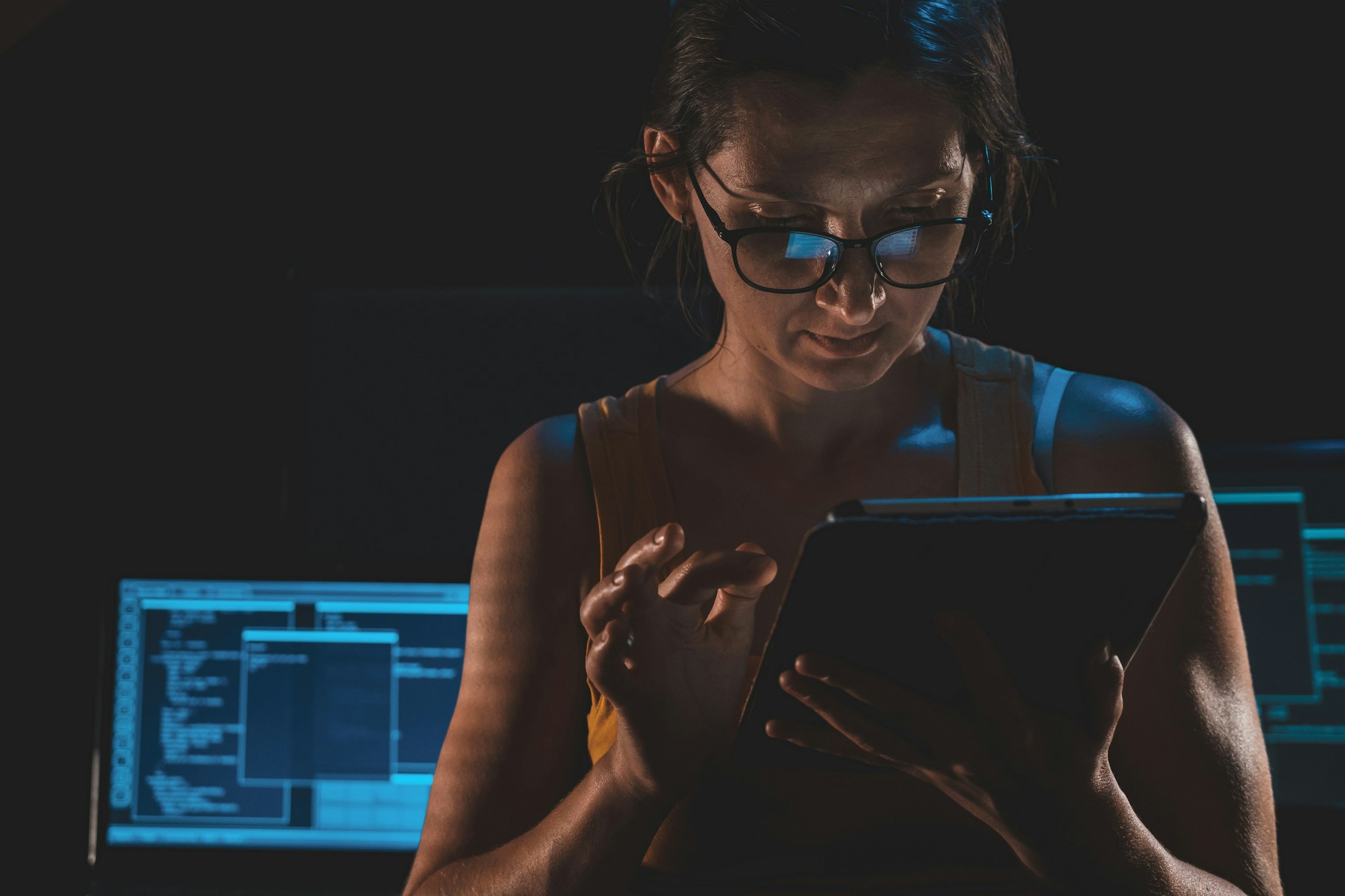 Woman Using Tablet - Jasper vs ChatGPT