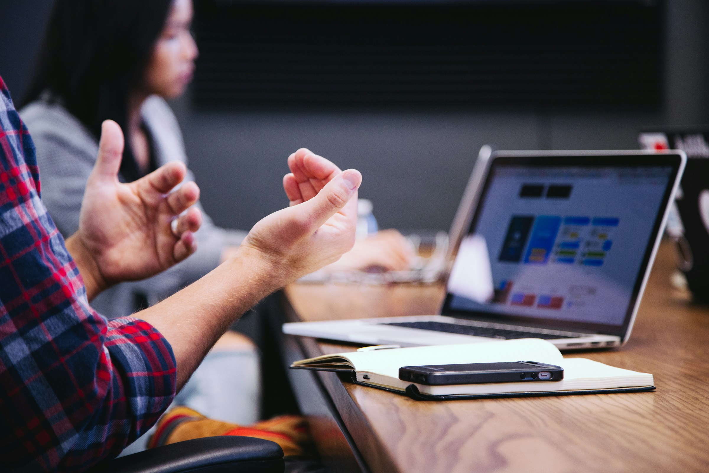 Person Discussing - SEO Packages Pricing