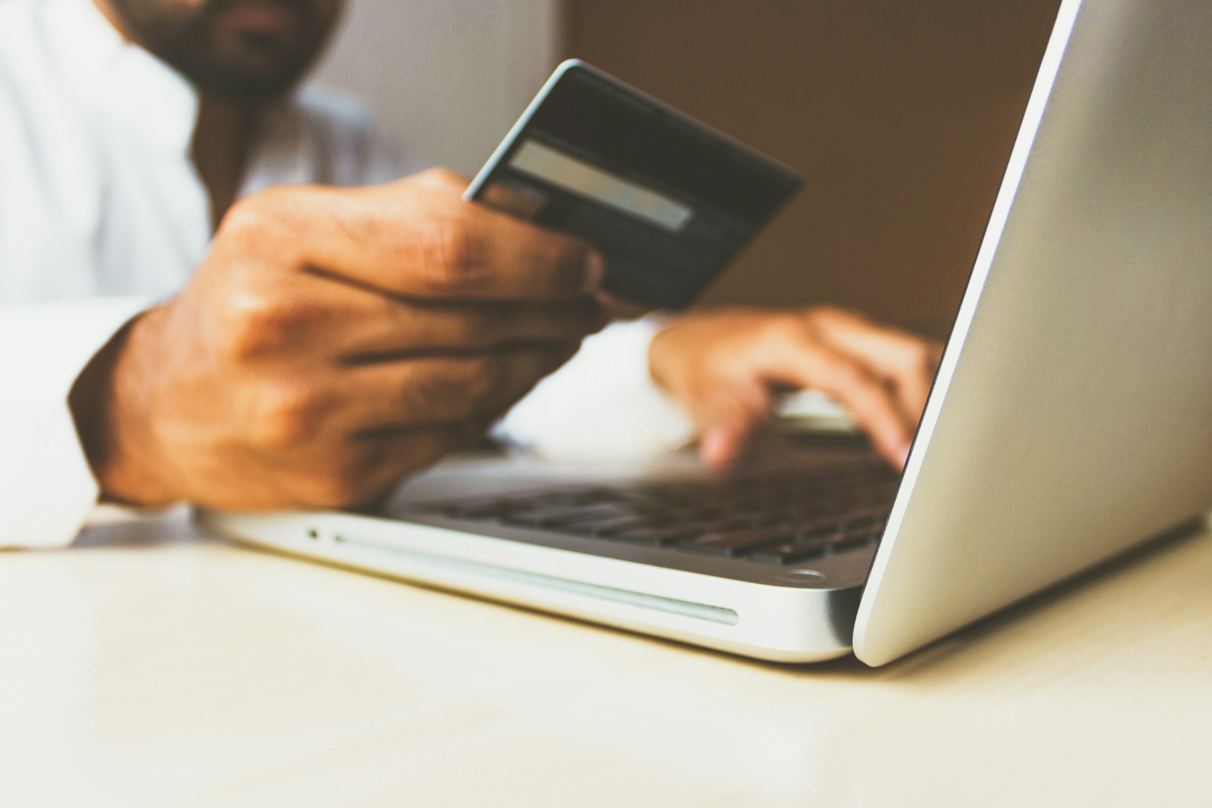 person with credit card - How to Write Website Content