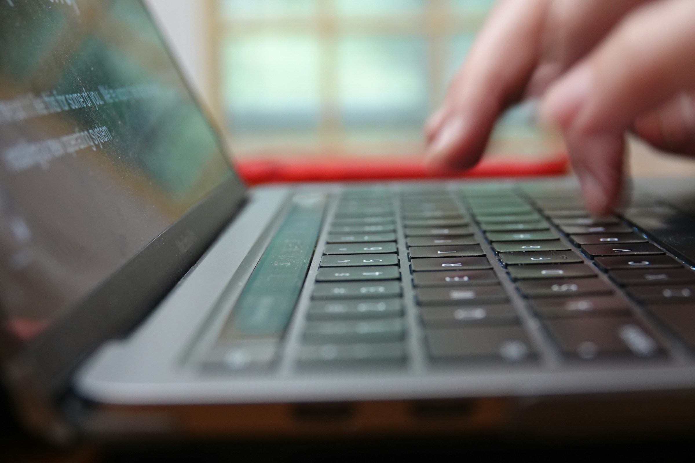 Man Typing - Writesonic vs ChatGPT