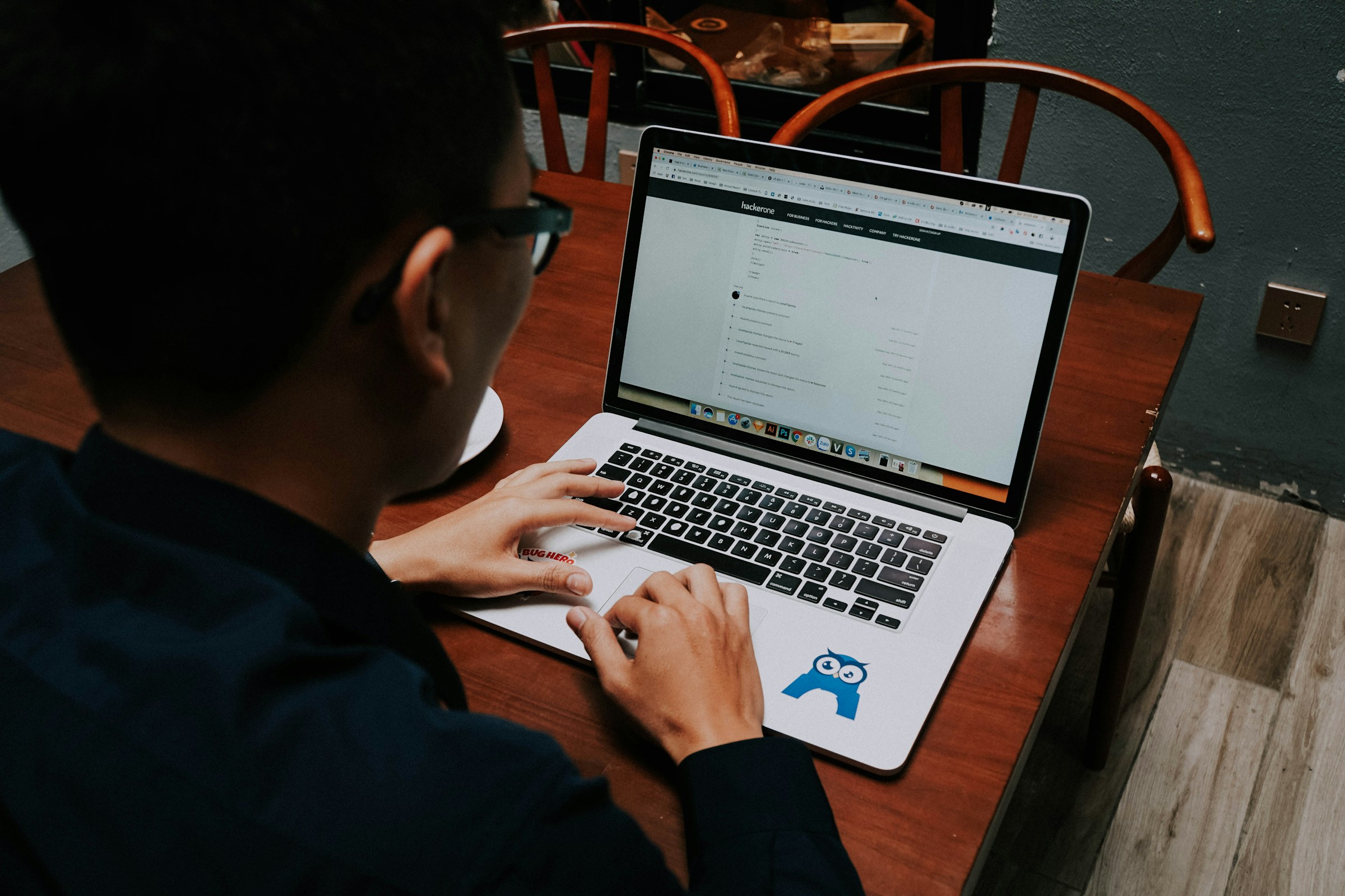 Person Using Laptop - Writesonic vs ChatGPT
